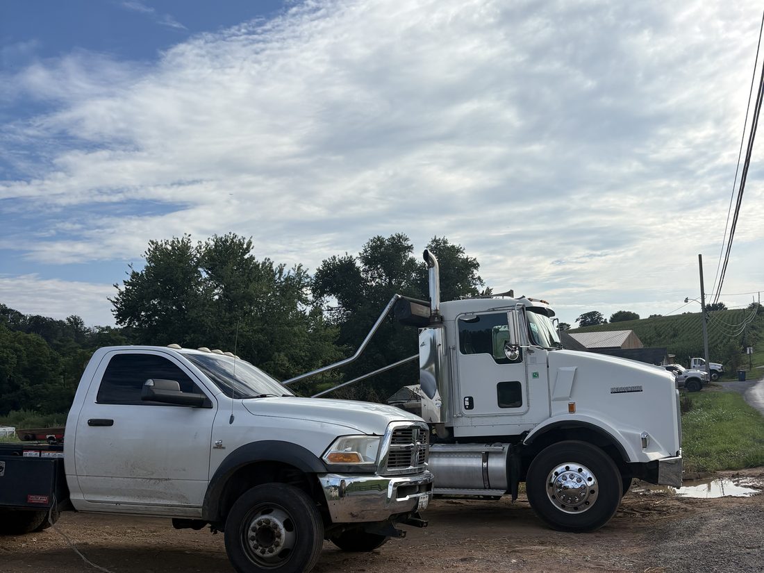 Savage's Waste Solutions flatbed truck and pickup truck